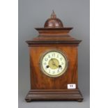 A German made walnut veneered mantle clock, H. 43cm.