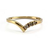 A 9ct yellow gold wishbone ring set with white stones, (M.5).