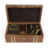 A case containing several navigation instruments including a miniature sextant, telescope, compass