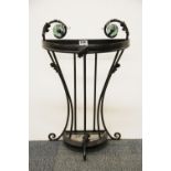 A black painted metal and green glass umbrella stand, H. 60cm L. 40cm.