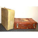 Two vintage suitcases, one with travelling stickers, largest 60 x 40 x 25cm.