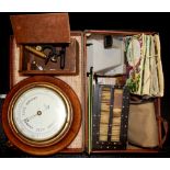 A case containing a quantity of interesting items including a polaroid camera, a miniature