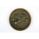 A 19th Century French bronze plaque depicting an erotic scene, Dia. 15cm.