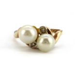 A 10ct yellow gold (stamped 14k) ring set with pearls and diamonds, (K).