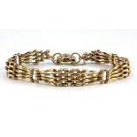 A 9ct yellow gold triple gate bracelet.