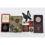 A quantity of non military medals and badges.