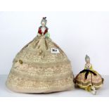 Two porcelain pin cushion half dolls, H. 32cm H. 15cm.