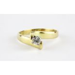 An 18ct yellow gold (stamped 18ct) brilliant cut diamond set solitaire ring, (K).