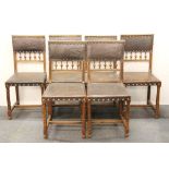 A set of six French carved oak dining chairs with Art Nouveau embossed leather upholstery.