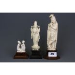 Three early 20th Century Indian carved ivory figures raised on wooden pedestals, H. 20cm 16.5cm 7.