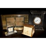 A boxed Waterford crystal clock, an Art Deco desk clock a travelling clock and a desk calendar.