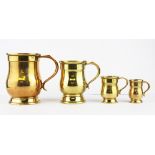 A set of four bronze graduated tankards, tallest H. 12.5cm.