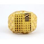 A yellow metal (tested minimum 22ct gold) gentleman's signet ring, (Q).