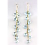A pair of 18ct yellow gold (stamped 18k) drop earrings set with briolette cut blue topaz, L. 9cm.