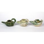 Antiquities interest. Three early green glazed terracotta oil lamps, tallest H. 6cm.