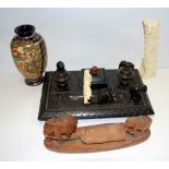 A box containing two carved bone items, a desk stand and a small Satsuma vase.