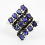 A 925 silver ring set with oval cut kyanites and black spinel, (R).