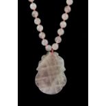 A Chinese carved rose quartz amulet necklace, L. 40cm.