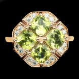 A 925 silver rose gold gilt ring set with four cushion cut peridots and cubic zirconia, (M), Dia.