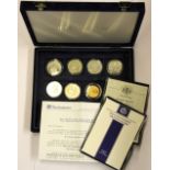 A case containing six silver commemorative coins and one Chinese commemorative coin.