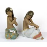 Two Lladro terracotta figures of bathing Polynesian girls, H. 20cm.