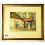 A gilt framed watercolour of a cottage, signed Leslie Harrap circa 1985, framed size 35 x 29cm.