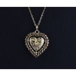 A 9ct yellow gold heart shaped pendant and chain.