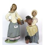 Two boxed Lladro terracotta figures of 'Seasonal Gifts' and 'In Search of Water' H. 44cm H. 38cm.