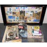 A framed collection of moon landing memorabilia together with other related publications.