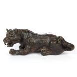 An oriental bronze figure of a tiger, H. 10cm L. 27cm.