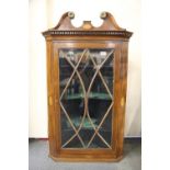 A Georgian marquetry decorated corner cabinet with glazed front, H. 113cm W. 68cm.
