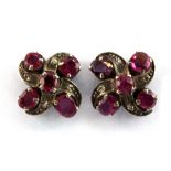 A pair of white metal ruby and diamond set earrings, L. 1.3cm.