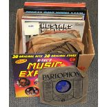 A box of 45RPM and LP records.