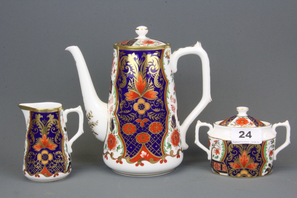 A Royal Crown Derby 'Rich Japan Pardoe' pattern three piece coffee set, tallest H. 17cm.