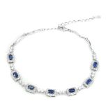 A 925 silver oval cut sapphire and cubic zirconia set bracelet, L. 17cm.