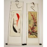 Two Chinese silk mounted scrolls; one depicting fish, the other a watercolour depicting flowers,