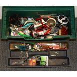 A case containing fishing reels and other fishing gear.