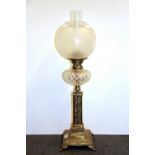 A Victorian cut glass and gilt brass oil lamp, H. 73cm.