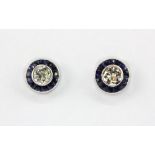A pair of 18ct white gold (stamped 750) stud earrings set with brilliant cut diamonds and sapphires,