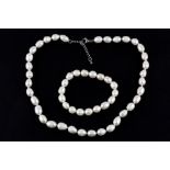 A cultured pearl necklace and matching adjustable bracelet, L. 40cm.