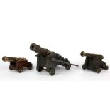 Three bronze miniature cannons, tallest H. 7.5cm.