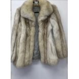 A vintage Arctic fox fur jacket.