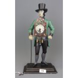 An early 20th century Black Forest 'Schwardzward' 'Man of Time' figural clock, H. 39cm.