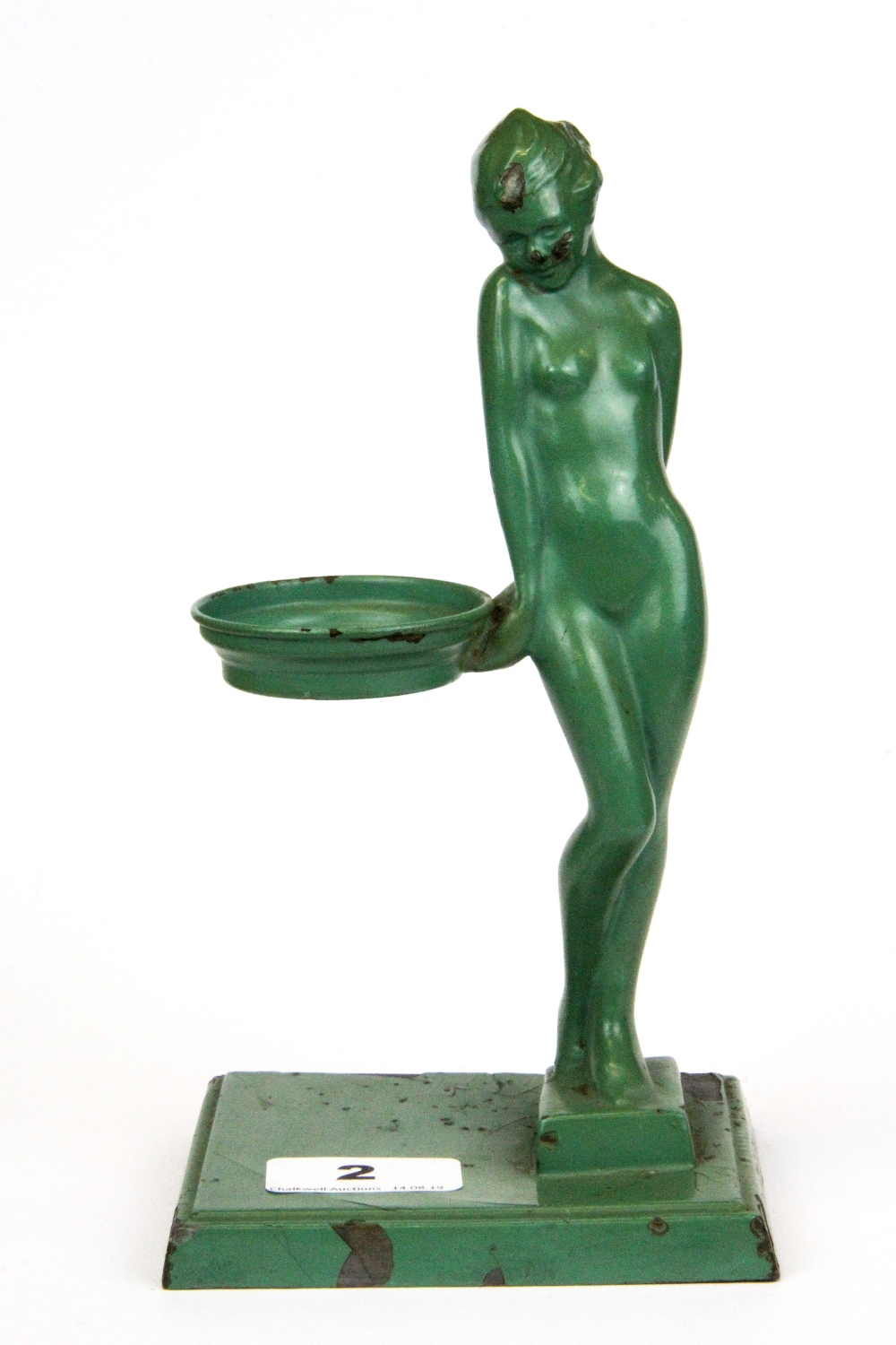 A 1920's Art Deco green painted metal figural tea light holder, H. 21cm.