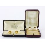 A pair of 9ct yellow gold pearl set screw back fitted earrings together with a pair of 9ct gold