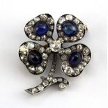 A French yellow and white metal (tested silver and gold) four leaf clover shaped brooch set with old