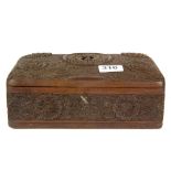 An oriental carved wood cigarette box.