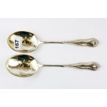 Two hallmarked silver berry spoons, L. 23cm.