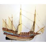 A handmade and painted wooden model of a 18th Century Carabela sailing ship.