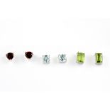 Three pairs of 925 silver stud earrings; set with emerald cut peridots, cushion cut blue topaz and